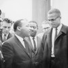 Martin Luther King and Malcolm X waiting for press conference